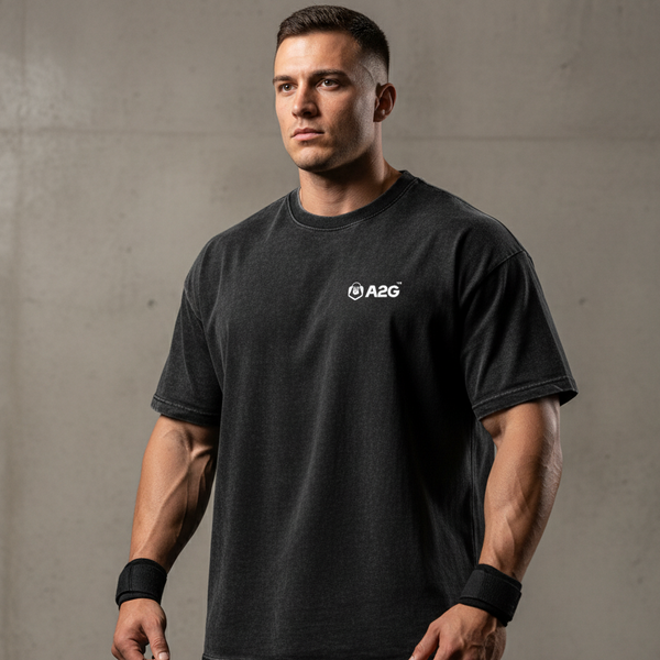Man wearing a black t-shirt with A2G logo against a gray background